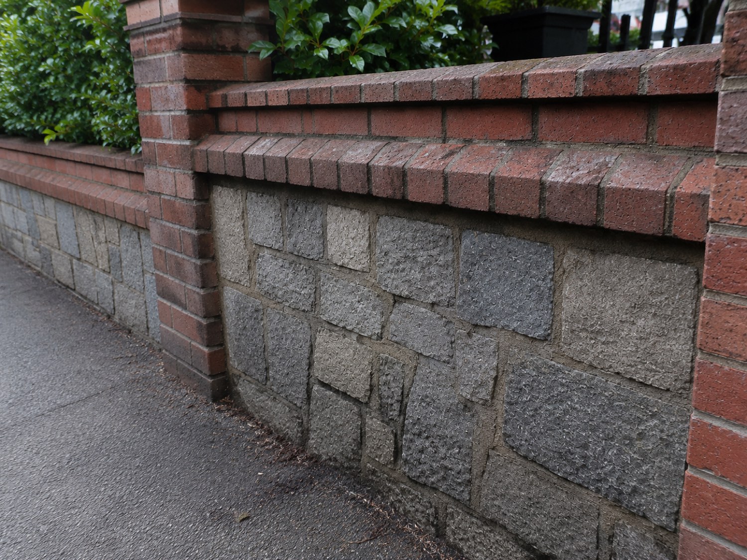 The same stone wall after cleaning — bright masonry