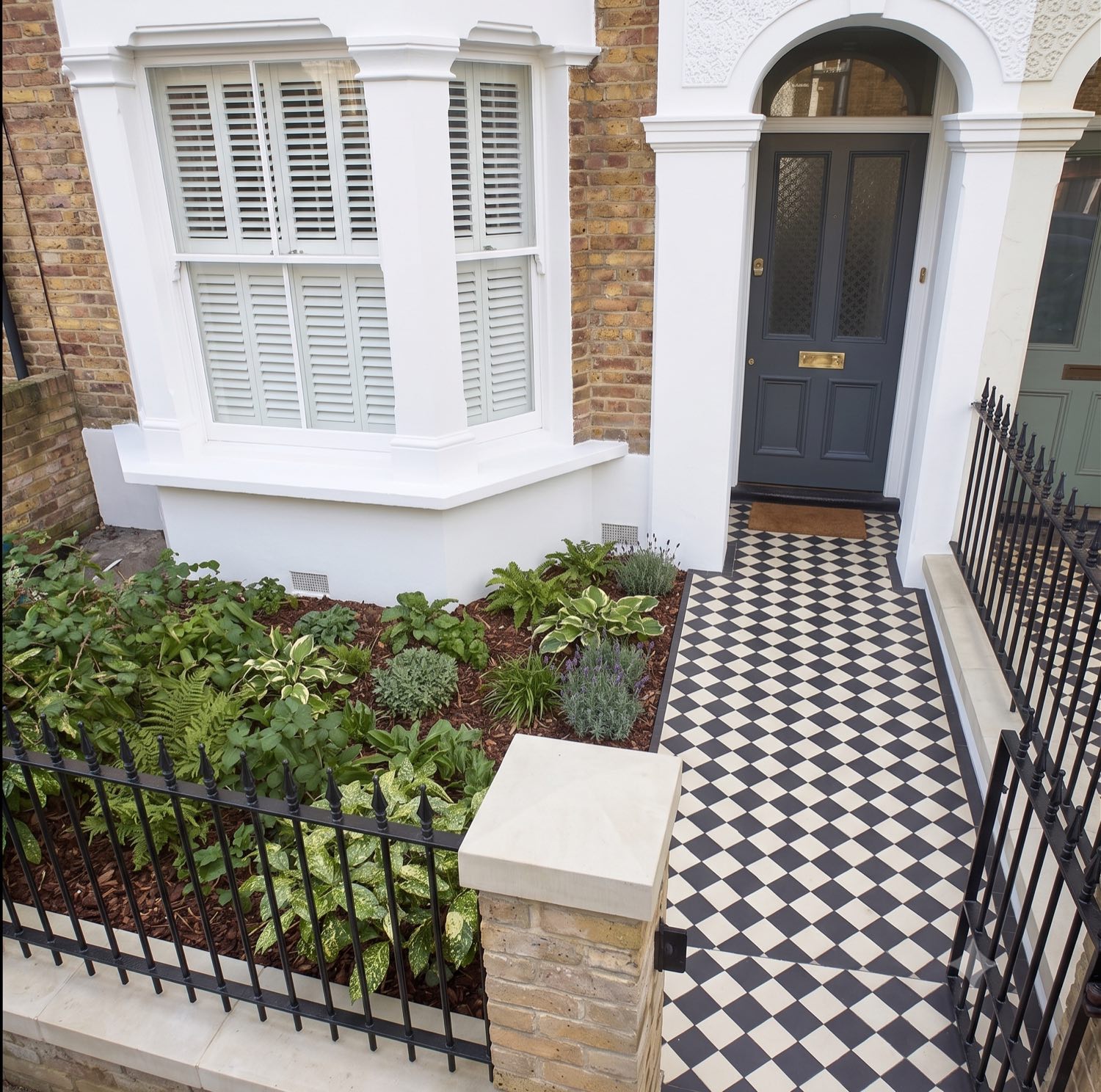 The same rendered frontage after cleaning — fresh, even finish